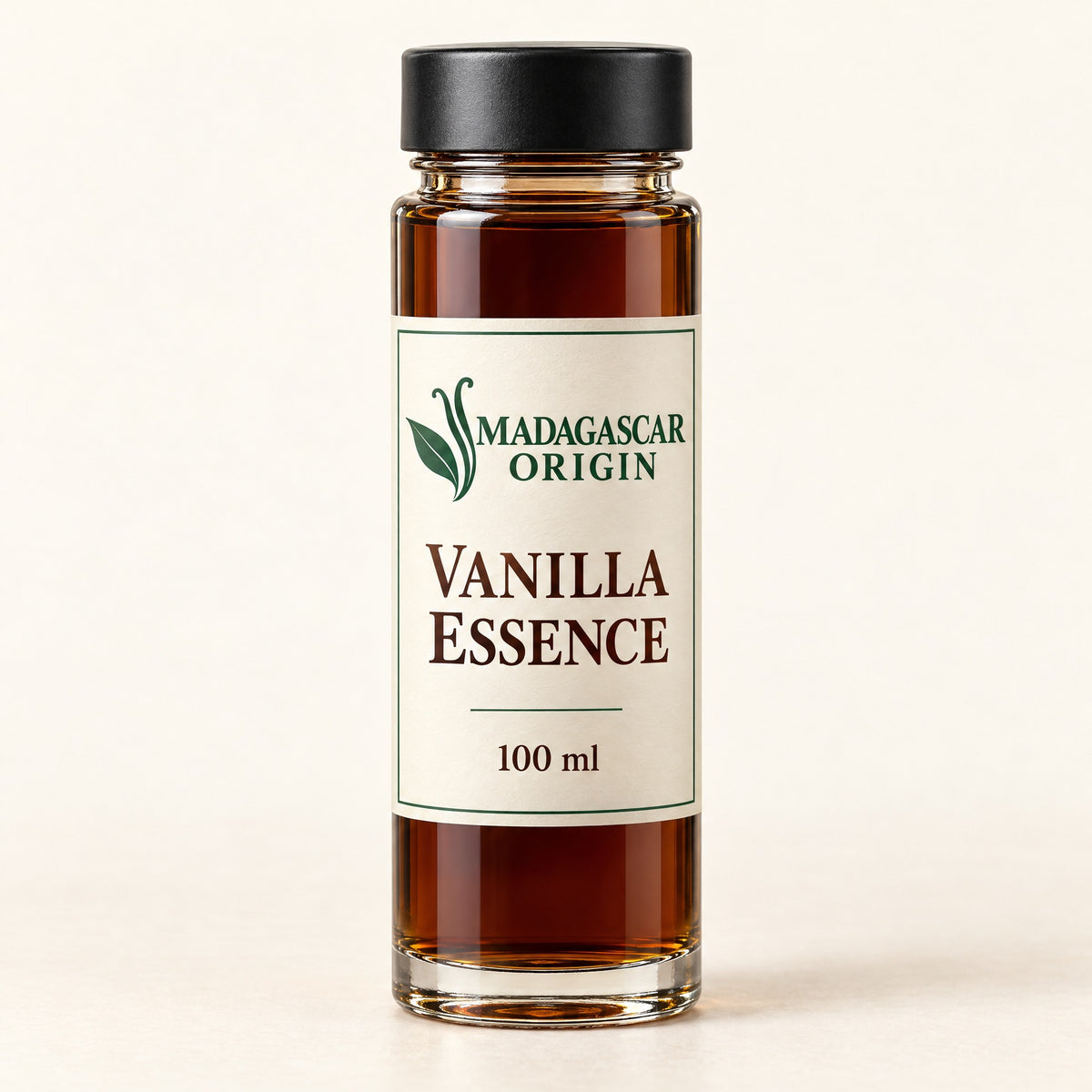 Madagascar Origin Vanilla Essence 100 ml in a glass tube with an ivory label and black cap - packaging mockup